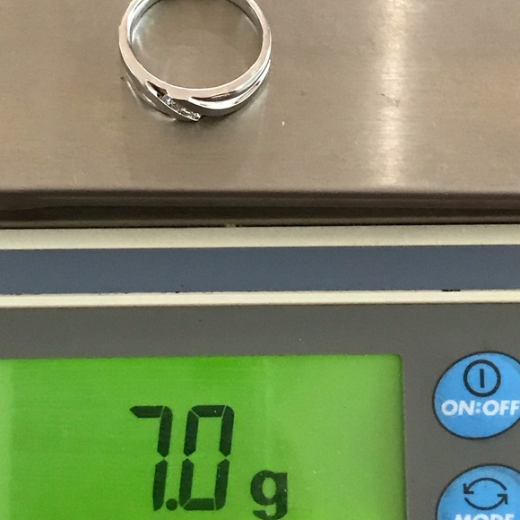 Men's.30 ctw diamond & solid 10 kt heavy WG ring